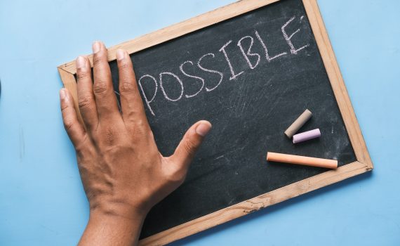 a chalkboard with the word possible written on it